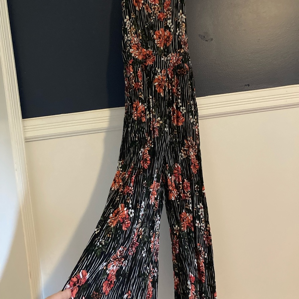 One piece jumper with pockets.